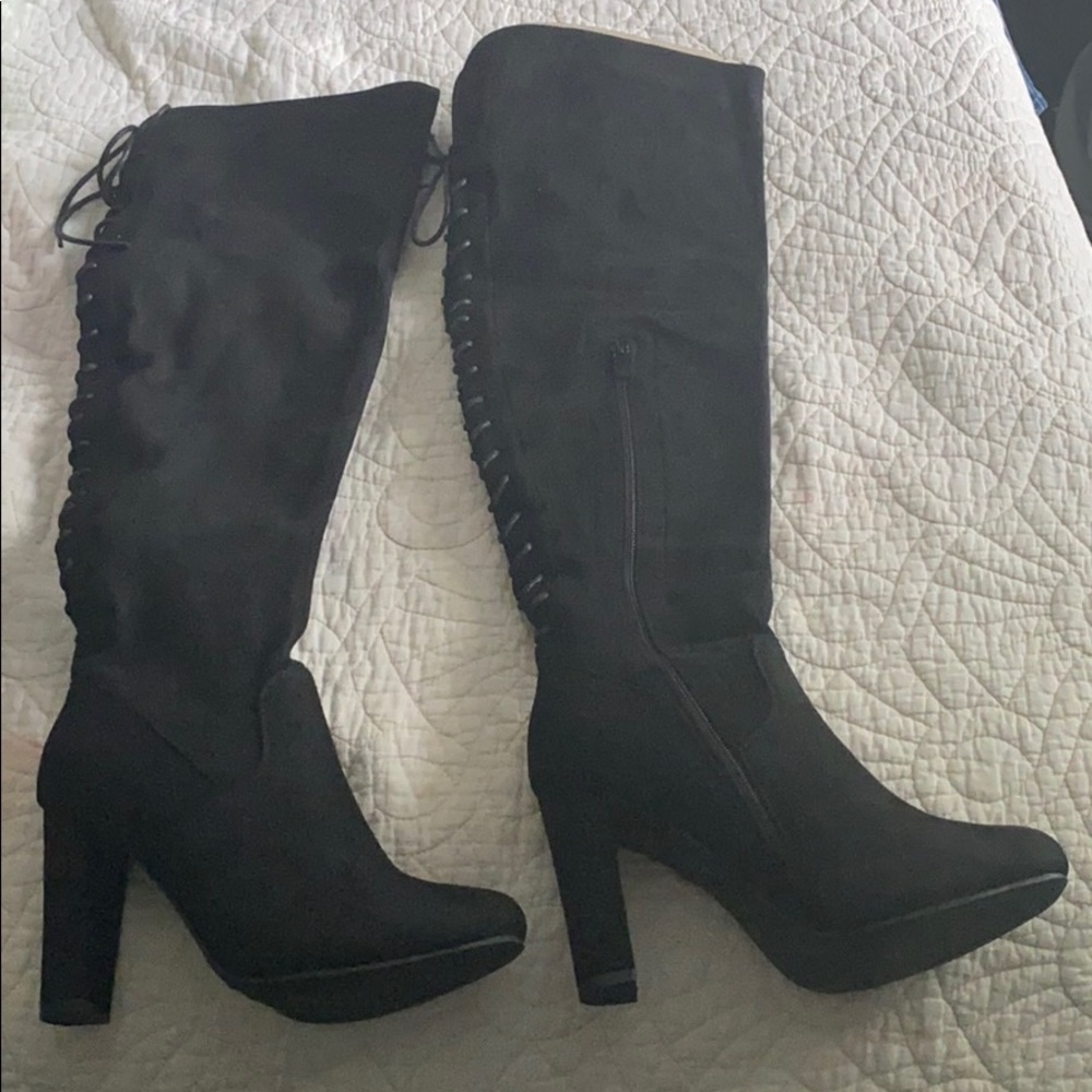 Black thigh high heeled boots